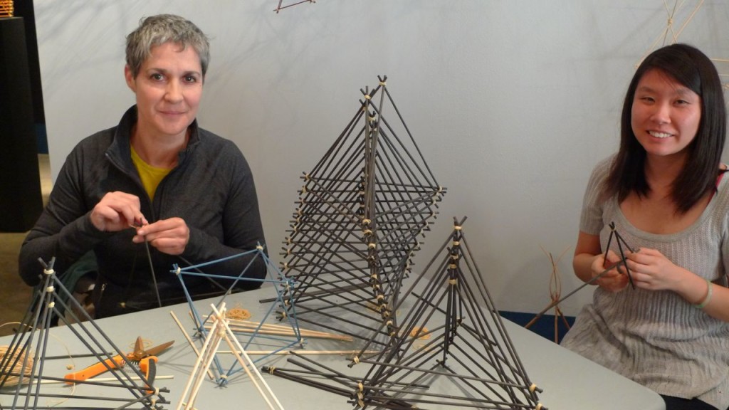 Margaret Wertheim and Tracy assembling tetrahedrons.