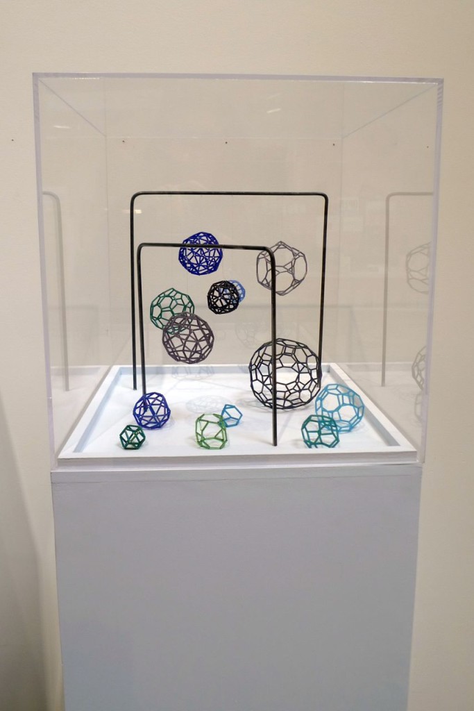 The 13 Archimedian solids, realized in wire and bugle beads, by Kathryn Harris.